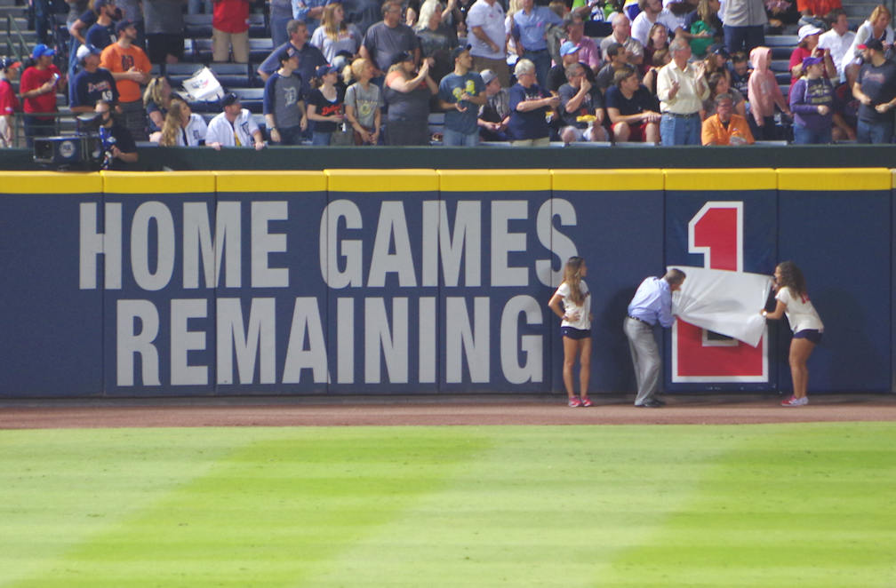 John Schuerholz participates in the countdown on October 1, indicating only one more game remains at Turner Field